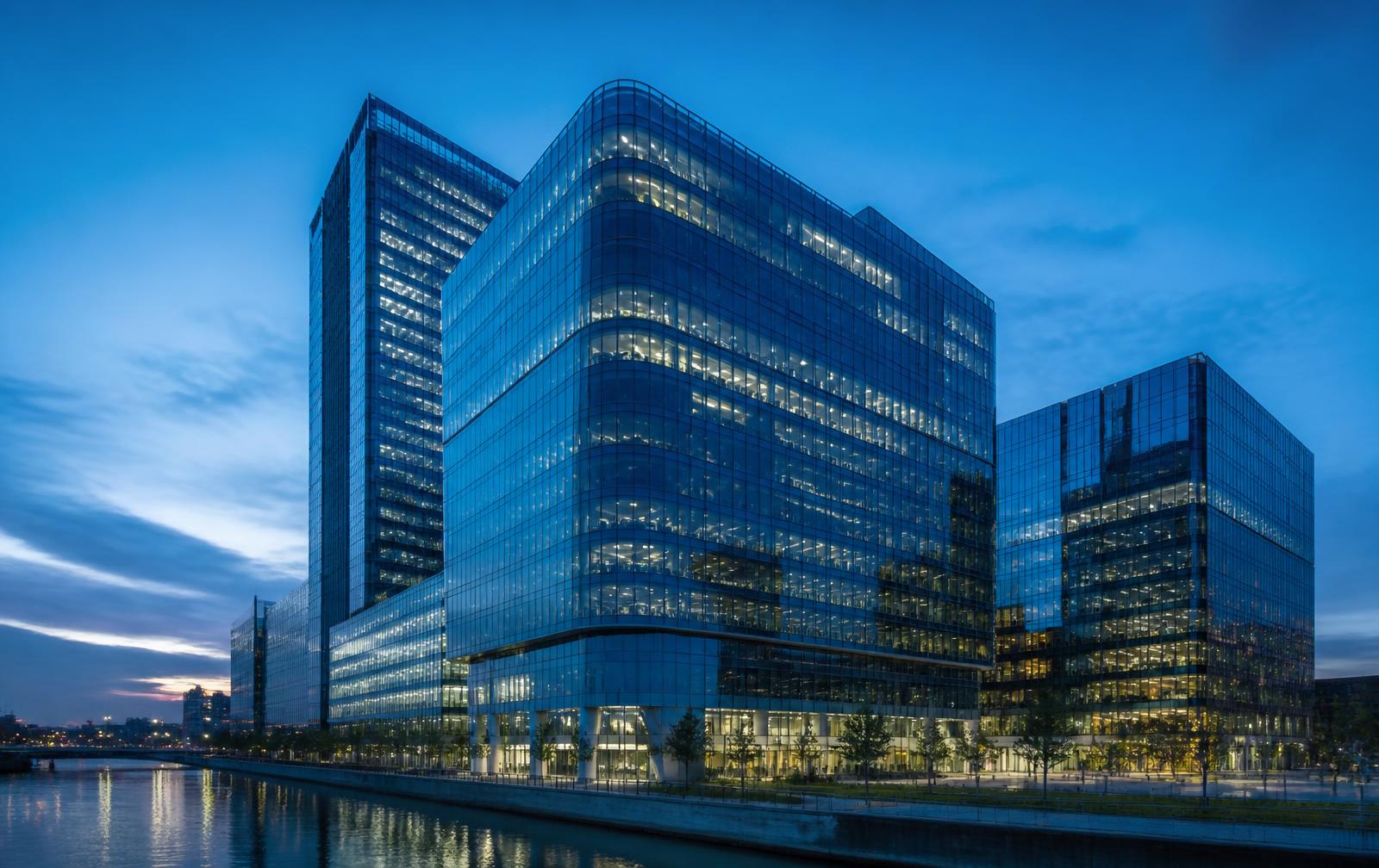Glass office towers of a financial district at dusk